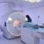 Radiographer assisting a patient during an MRI scan.