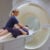 A radiographer preparing a patient for an MRI scan at SCP Radiology.